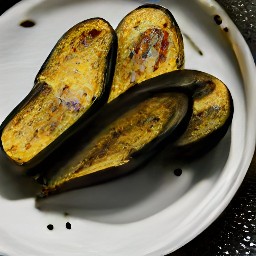 there halved roasted eggplants on a plate, with salt and black pepper to taste.