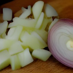a bowl of chopped onions and carrots.