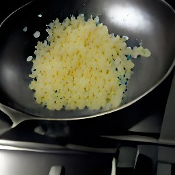 a pan of onions and garlic cooked in olive oil.