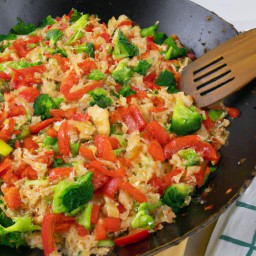 

This delicious veggie egg-fried rice is a perfect lunch option that is both nuts and lactose free! It's made with eggs, broccolis, and white rice stir-fried in a wok for an Asian flavor.