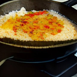 a dish containing shredded eggs, onion slices, black pepper, soy sauce and sesame oil.