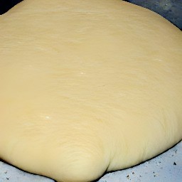 the dough is pressed down to create a puff pastry base.