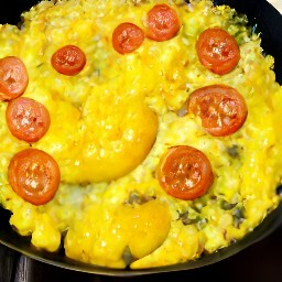 a dish called huevos a la mexicana, which is a traditional mexican dish consisting of eggs, tomatoes, onions, and peppers.