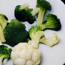chopped broccoli and cauliflower, peeled garlic, and finely chopped parsley.