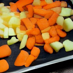 the marinated veggies are transferred to a baking sheet.