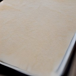 the baking parchment should cover the baking sheet properly.