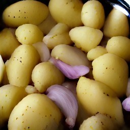 a bowl of potatoes with shallots, garlic, mustard seeds, olive oil, salt and black pepper.