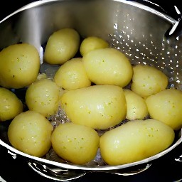 boiled potatoes that have been rinsed and drained in a colander for 2 minutes.
