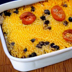 a casserole with grated cheddar cheese.