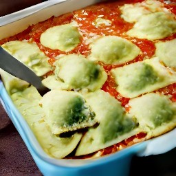 a dish with three layers - spaghetti sauce, cheese-filled ravioli, and spinach. the top layer is covered in mozzarella and parmesan cheese.