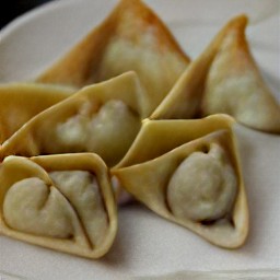 spring rolls filled with cheese mixture and folded into triangles.