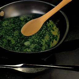 a dish of garlic, nutmeg, mascarpone cheese, spinach, cream, salt and pepper.