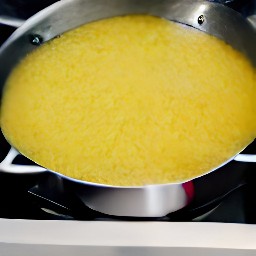 a pan of couscous with basil and garlic.