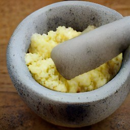 the output of crushing peeled garlic using a mortar and pestle is a paste.