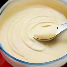 a bowl containing a mixture of butter, granulated sugar, corn flour, and all-purpose flour.