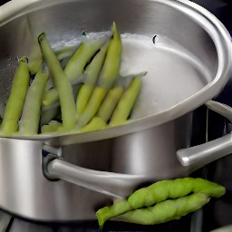 adding beans pods strips to boiling water.