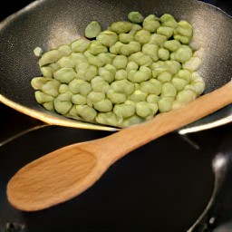 a dish of fava beans cooked in butter and olive oil, with garlic, salt, and pepper.