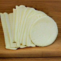 a cheese log that has been sliced.