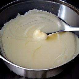 a bowl of creamy mixture.