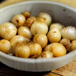 the contents of the pot are transferred to a bowl.