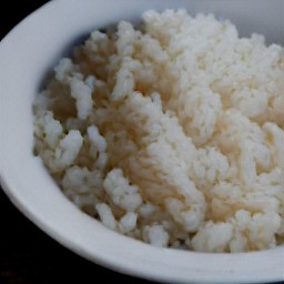 a plate of cooked white rice.