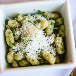 

A delicious European Italian dinner of gluten-free, eggs-free and soy-free parsley, cashew nut and olive oil pesto with parmesan cheese over gnocchi and green beans.