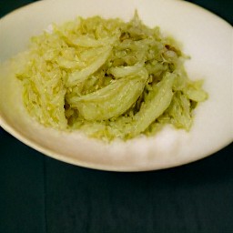 a plate of stir-fried cabbage with ginger, garlic, shallots, and horseradish.