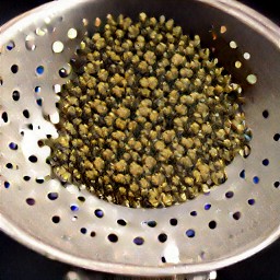 the capers are rinsed and drained in a second colander.