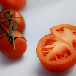 cherry tomatoes that are cut halfway.
