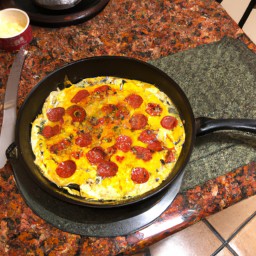 
A vegan pepperoni omelet is a tasty, nuts-free European breakfast or brunch made with eggs, potatoes, onions and melted cheese.