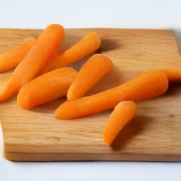 a peeled baby carrot.