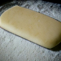 the dough is shaped into a rectangle on the floured surface.