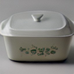 a corningware dish with potato pieces, garlic, lemon juice, olive oil, oregano and salt.