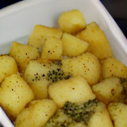 the corningware dish is removed from the oven without the lid.