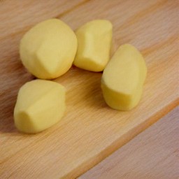 the potatoes peeled using a peeler.