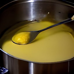a baking dish with melted butter in it.