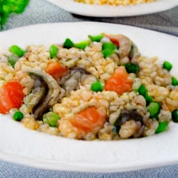 the peas and broth will cook for 10 minutes over medium heat, stirring occasionally. then the grated romano cheese is added to the saucepan and stirred in before being turned off and transferred onto a plate.