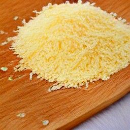 the romano cheese is grated into small pieces.
