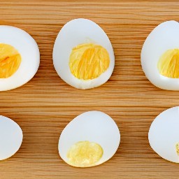 boiled eggs that are peeled and cut in half.