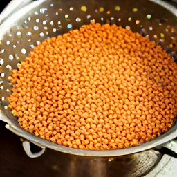 drained cooked lentils in a colander.