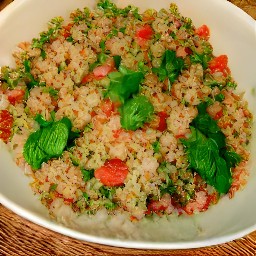 a bowl of quinoa tabouli salad.
