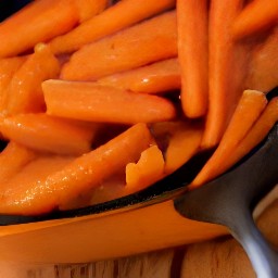 a side dish of mustard-flavored carrots.