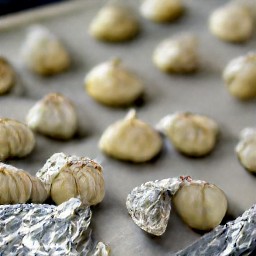 the baking sheet is removed from the oven and the heat is turned off.