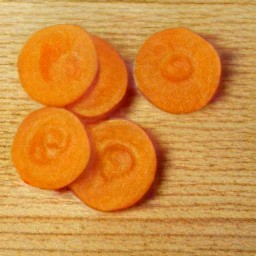 after peeling the carrots with a peeler, cut them into slices.
