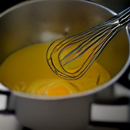 a bowl of whisked egg yolks.