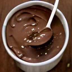 a bowl of batter containing margarine, granulated sugar, applesauce, vanilla extract, all-purpose flour mixture and chocolate mixture.