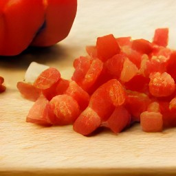chop a red onion. destalk red bell pepper and chop it, then cut lemons in half.