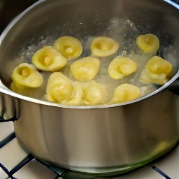 13 cups of water boiled with half a tsp of salt and cheese tortellini pasta cooked for 11 minutes on medium heat.