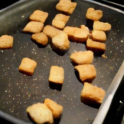 removing garlic croutons from the oven.