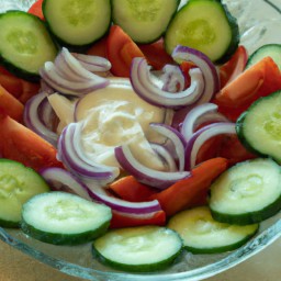 

Refreshing and light, this salad of cucumbers, onions, tomatoes and creamy sour cream dressing is a perfect soy-, gluten-, egg- and nut-free side dish for summer recipes that require no cooking.
